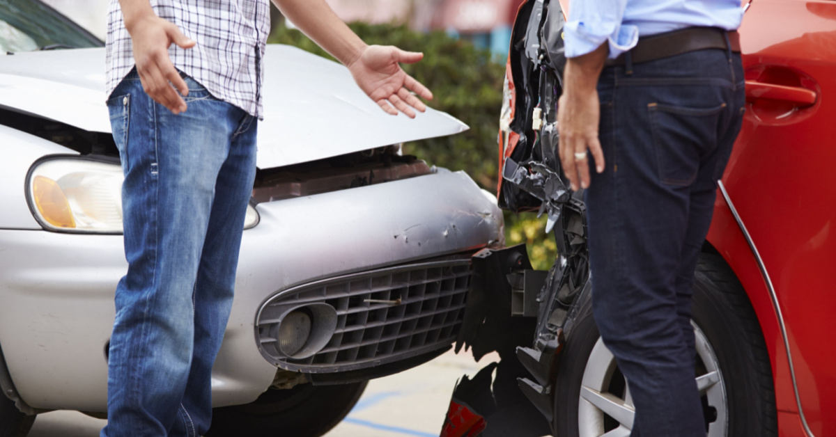 Two commuters in auto accident. The silver car appears to have rear ended the red automobile. Tampa auto accident lawyer Action Legal Group.